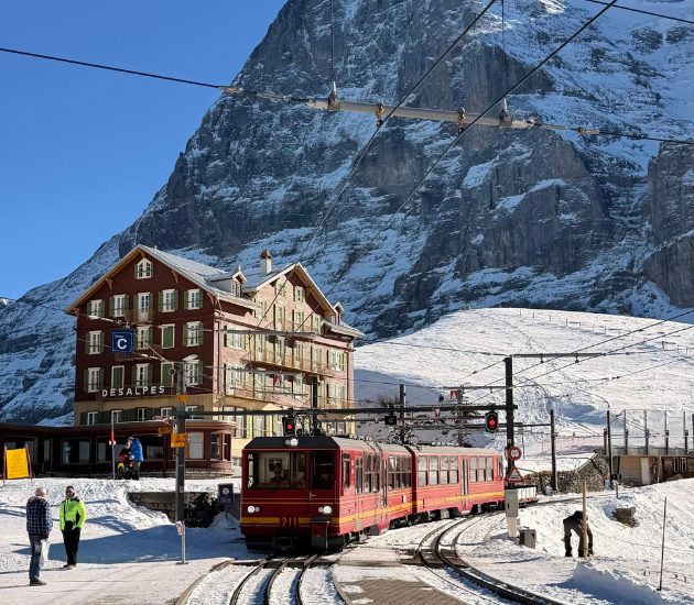 The iconic Jungfraubahn train station amidst the snowy Swiss Alps