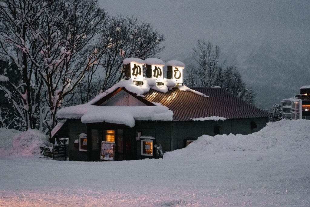 Snow-covered restaurant in snowy winter evening in Niseko, Hokkaido.